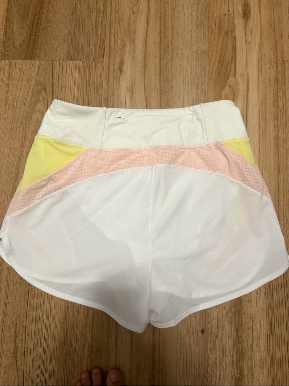 Sweaty Betty White Athletic Shorts with Pink and Yellow Accents - Picture 2 of 5